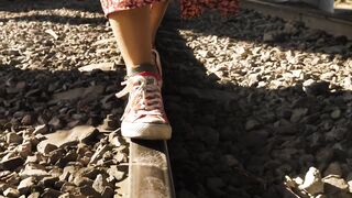 Person balancing on train track - adalinetv