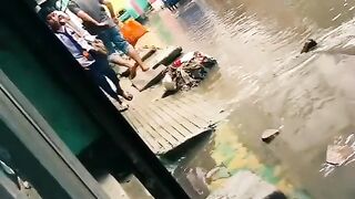 (Funny Video) A girl into Gutter Water in Rain.