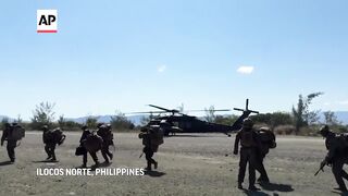 US and Philippine forces stage combat drills off southern Taiwan.