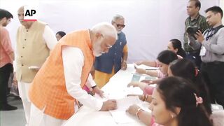 Indian Prime Minister Narendra Modi votes in general election.