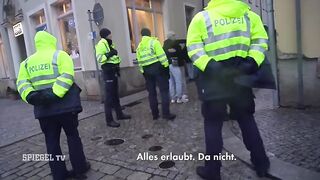 Showing the Nazi Salute infront of German Police