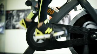 Feet pedaling on a fixed bike - adalinetv