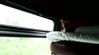 Young girl looking out the train window at nature - adalinetv