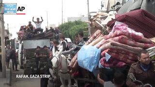 Thousands of Palestinians flee after Israel's overnight incursion in Rafah.