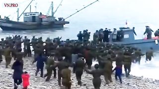 Footage of North Koreans running into the water to reach Kim Jong Un's boat