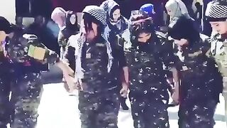 Kurdish female soldiers dancing in Raqqa after defeating ISIS, on streets where ISIS bought and sold women.