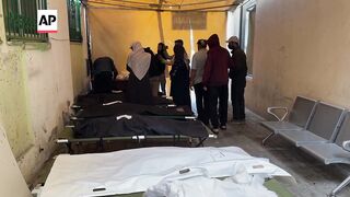 Loved ones in Rafah mourn for those who died after Israeli airstrike hit residential building.