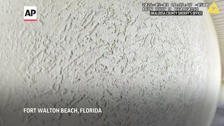 Body camera video shows fatal shooting of Black airman by Florida deputy in apartment doorway.