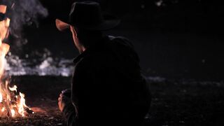 Person by a campfire - adalinetv