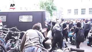 Pro-Palestinian student protesters clash with police in Amsterdam.