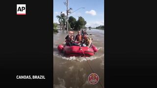 Horse rescued after being stranded on a rooftop by Brazil floods.