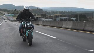biker-speeding-up-on-a-highway