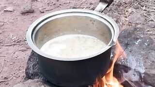Cooking Saffron tea on woods fire