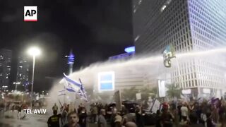 Israeli police use water cannon to disperse anti-government protesters in Tel Aviv.