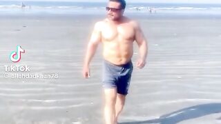 Golden man on the beach