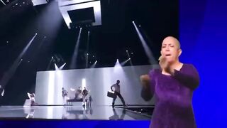 This sign language interpreter, signing the Eurovision Song Contest.