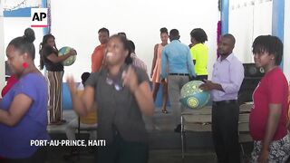 Parents in Haiti are taught how to help their children overcome trauma inflicted by gang violence.