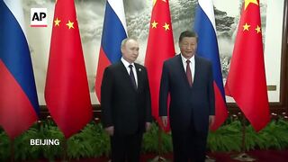 Putin and Xi hold talks in Beijing.