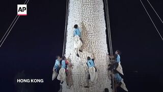 Watch the bun tower climbing competition in Hong Kong.
