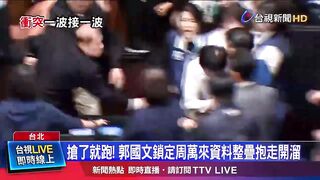 A member of Taiwan's parliament stole a bill and ran off with it to prevent it from being passed.