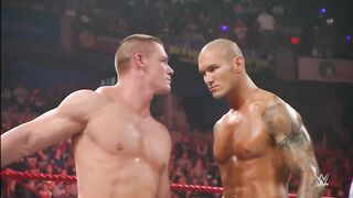 John Cena and Randy Orton brawl on top of the Hell in a Cell