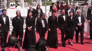 Director Jia Zhang-Ke premieres 'Caught By The Tides' at Cannes.