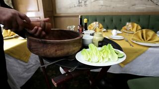 Chef preparing a salad in a restaurant