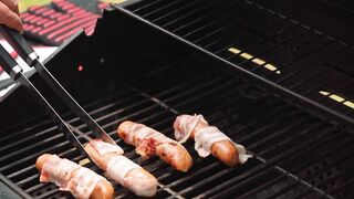 Grilled sausage is a savory dish where sausages are cooked over an open flame or on a grill