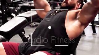 A boy is doing a hard workout in the gym.