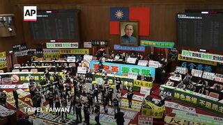 Taiwan’s legislature passes changes seen favoring China, reducing president’s power.
