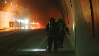 Firefighters working inside a dark tunnel  - adalinetv