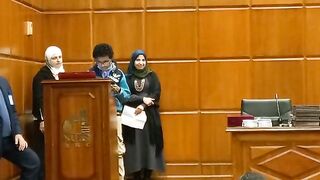 My son recites the Quran at the research center