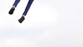 People are carried away by flying kites