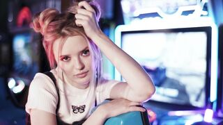 Close up shot of a playful female in an arcade game