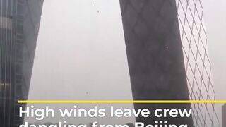 High winds leave crew dangling from Beijing skyscraper _ #AJshorts