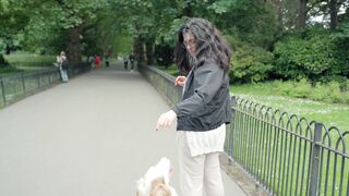 Woman feeds her dog