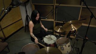Three  jamming in a music studio as a band