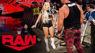Liv Morgan steps between Braun Strowman and Dirty Dom