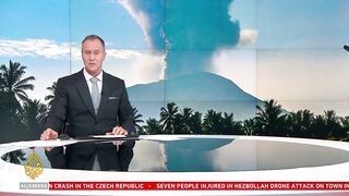 Indonesia's Ibu volcano erupts twice, spewing red- lava.