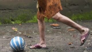 a grandmother kicks a ball