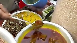 Hard working man selling food in Bangli streets