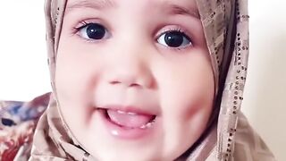 Small baby reading Quran