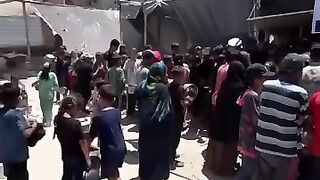 Displaced palestinian wait for their share of food in gaza palestine