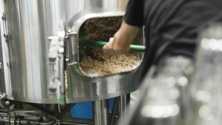 Barley shovelled out of a tank