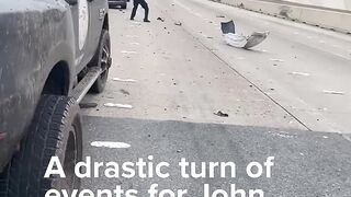 Samaritan helps drag injured officer to safety in Houston 59 Freeway shootout after chase ends.