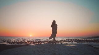 Three stunning elements: women, sea and sunset