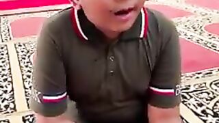 Boy practicing the Qur'an with his melodious voice...