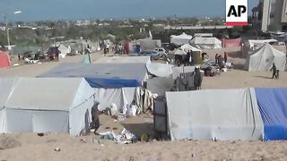 Displaced Palestinians leave Rafah camp following Israeli attacks nearby
