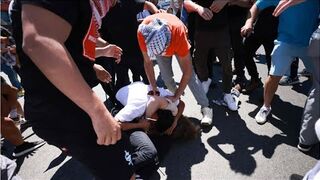 Pro-Palestine and pro-Israel protesters clash outside a Los Angeles synagogue