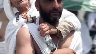 Old woman Hajj with her son